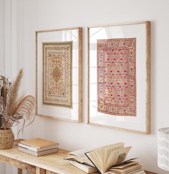 Framed colorful vintage Indian textiles hanging on a white wall