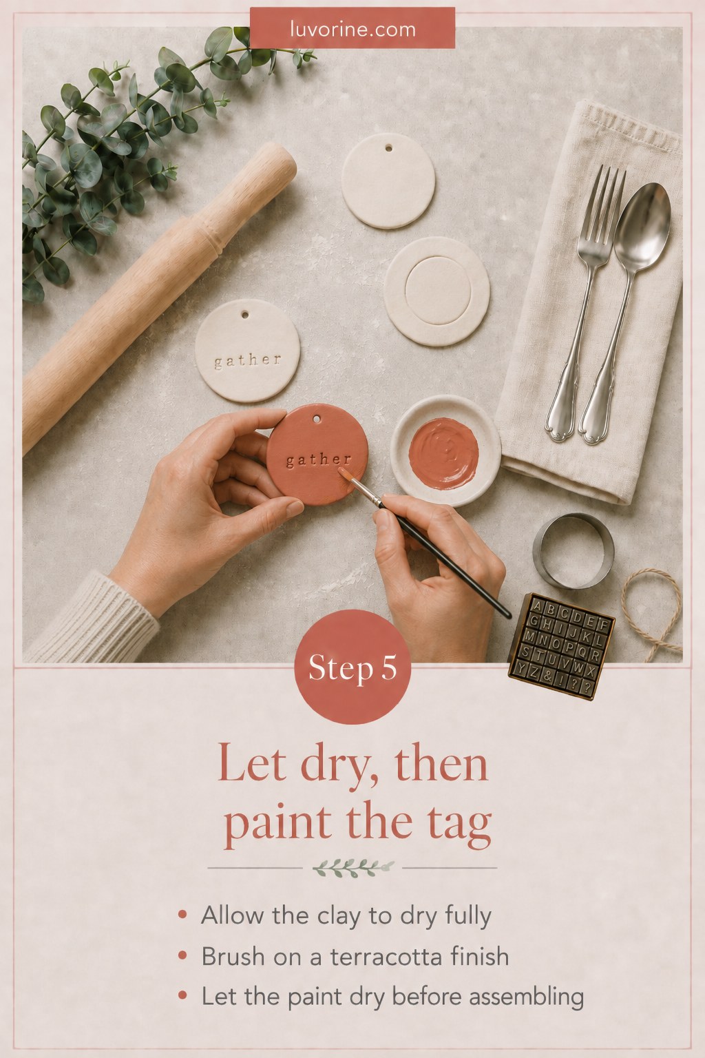 Painting a dried clay tag terracotta before assembling the finished napkin ring
