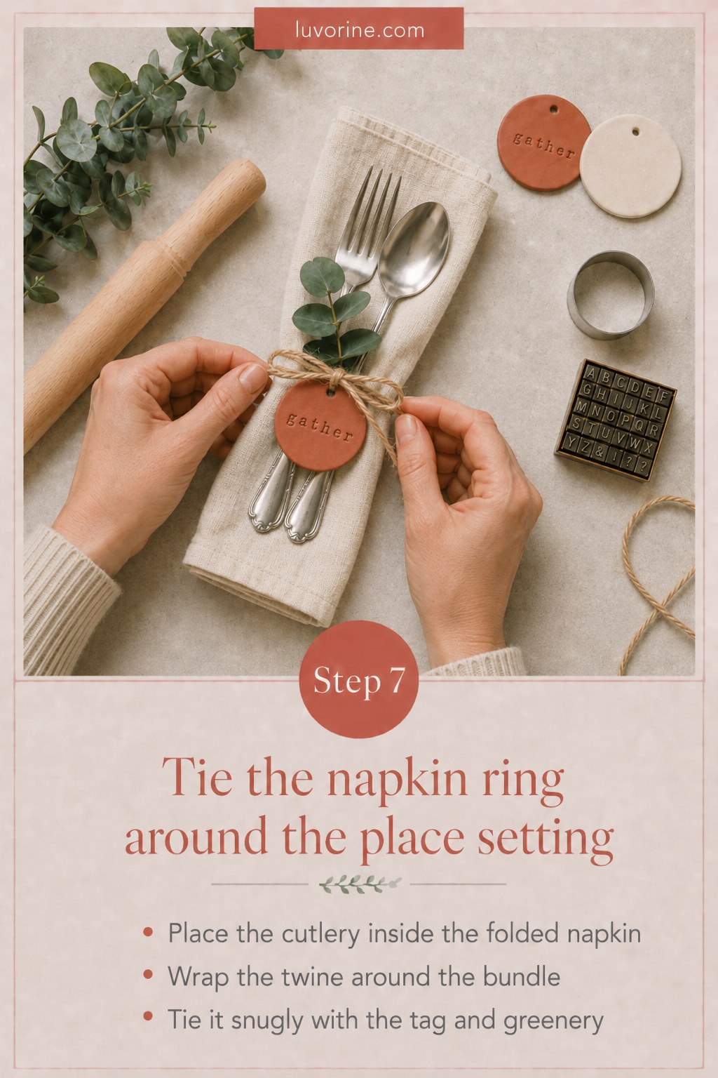 Tying the finished clay tag and twine around a folded napkin and cutlery