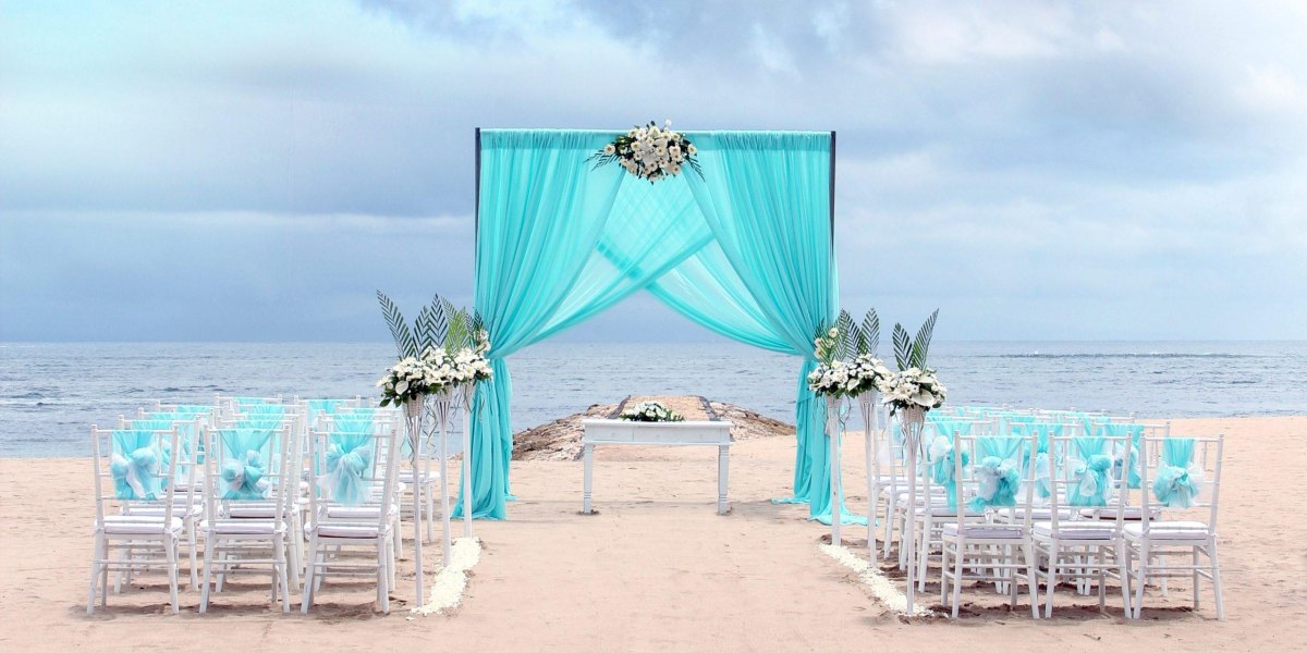 Aqua blue white coastal wedding setup