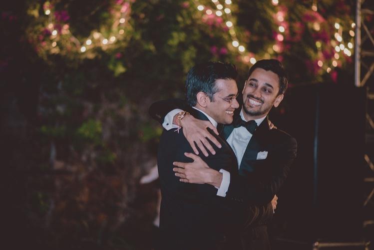Brothers celebrating at wedding