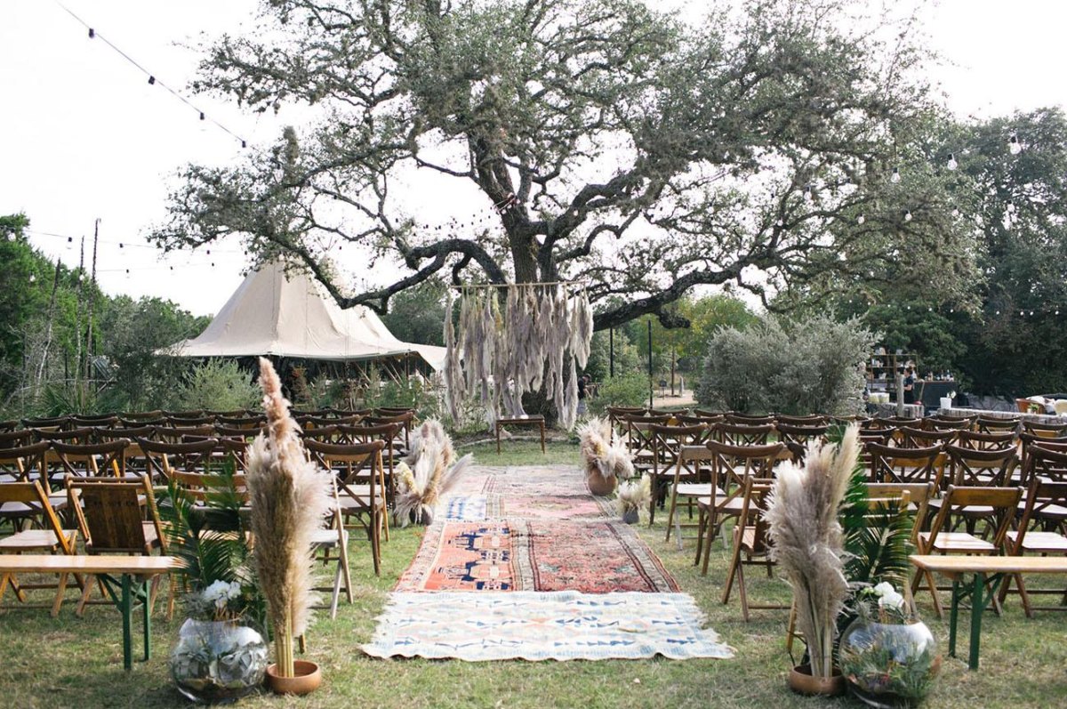 Bohemian outdoor wedding seating setup