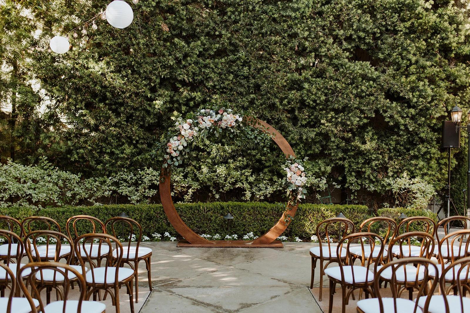 Circular moon gate wedding arch with flowers