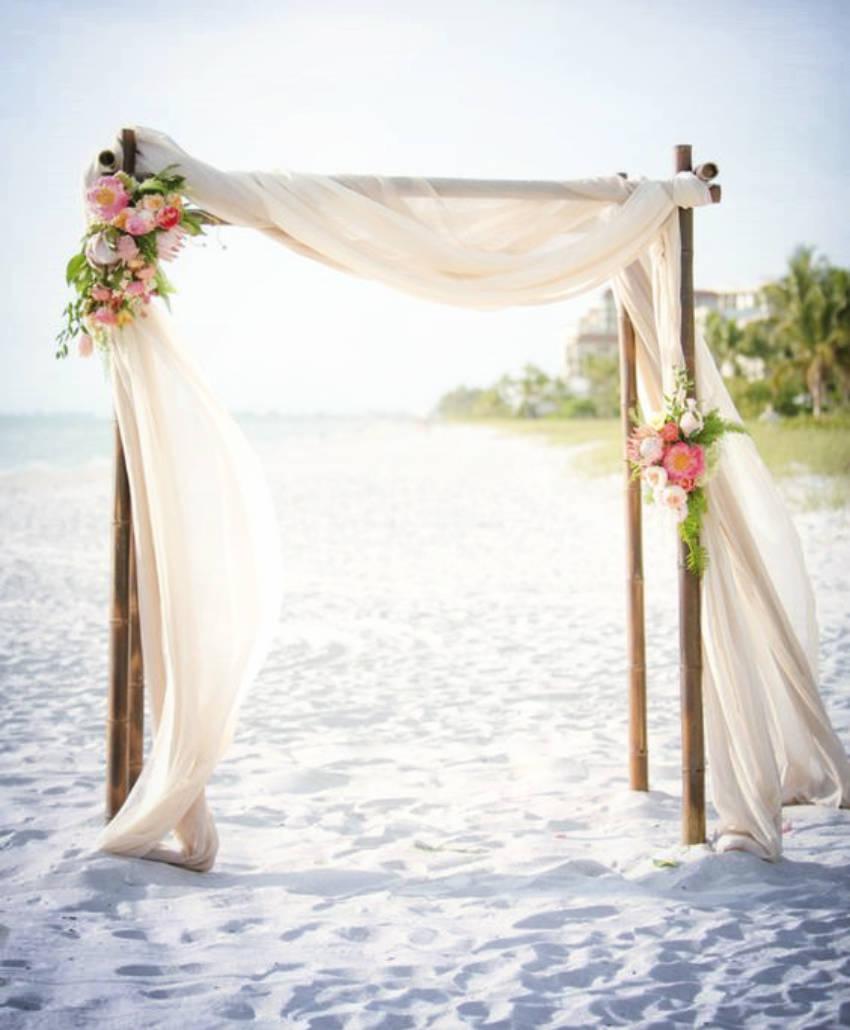 Handmade beach wedding arch by ocean