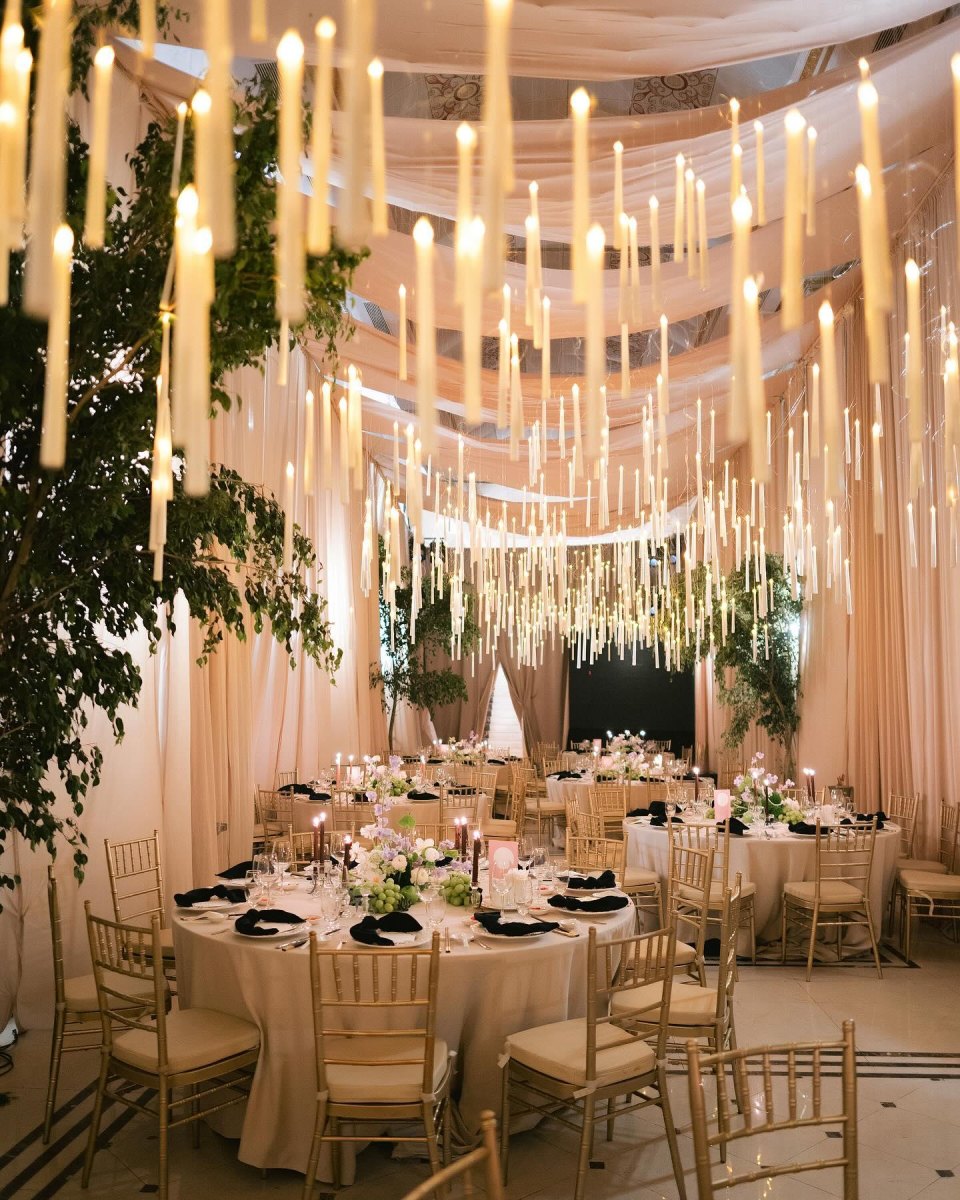 Candle chandeliers at wedding reception