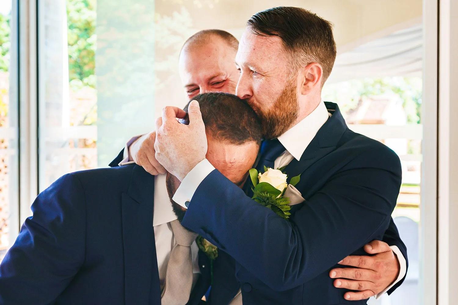 Groom and best man emotional moment
