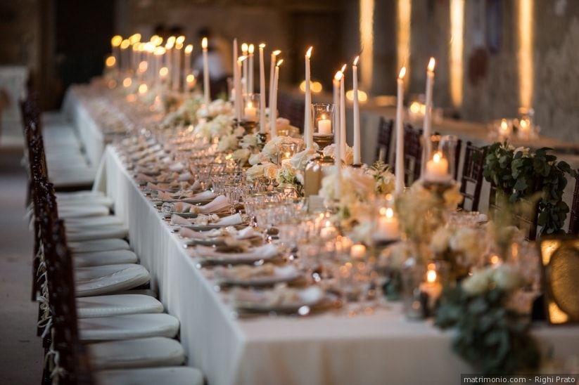 Long candlelit wedding banquet table