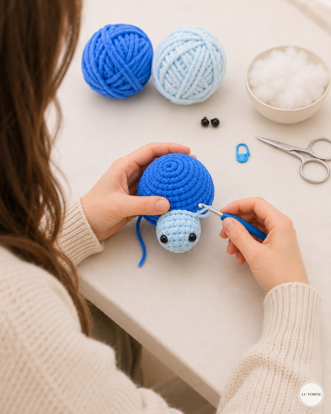 Crocheting the head onto the body in natural light during a real no-sew plush turtle project
