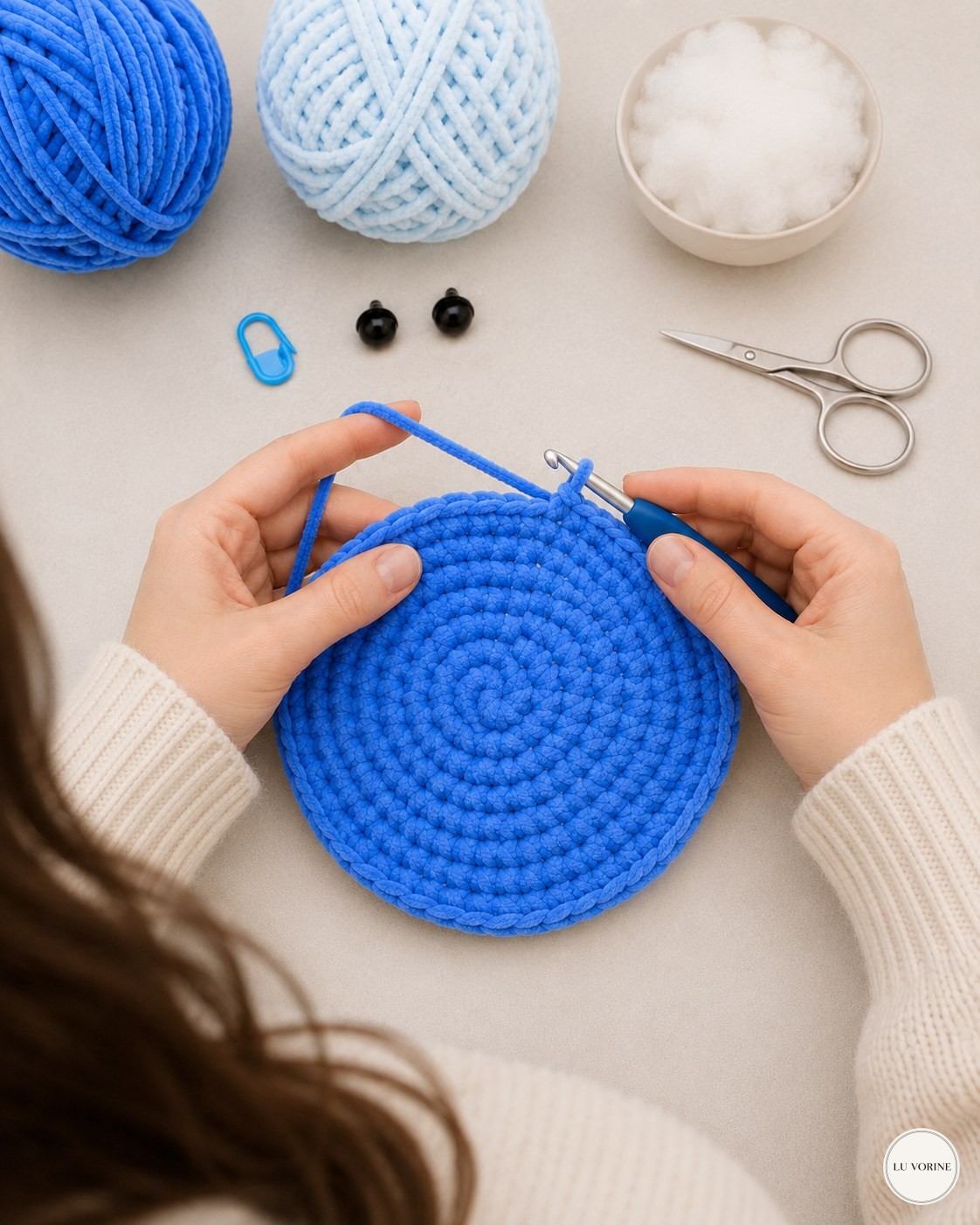 Real-life photo of the blue shell circle growing on the table while making a no-sew plush turtle