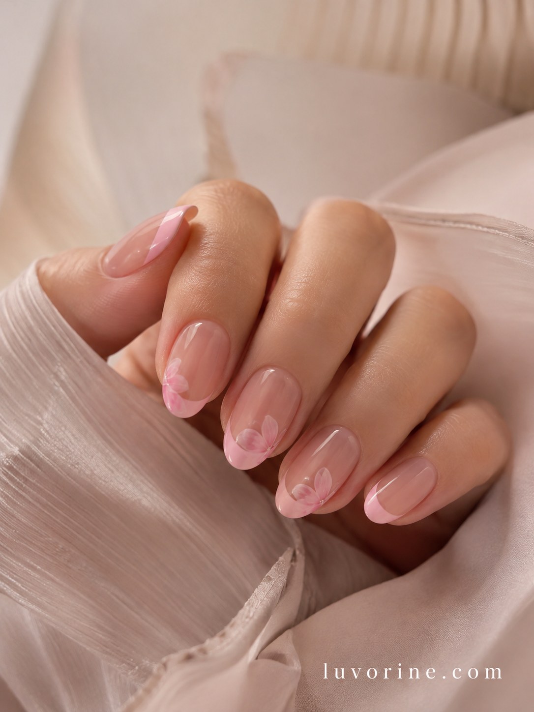 Glazed almond pink short nails with a subtle soft heart accent near the cuticle