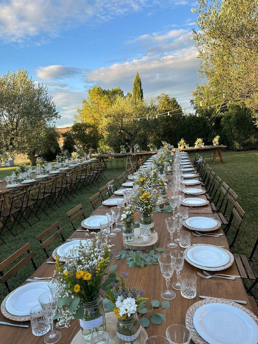 Rustic wooden wedding table with wildflowers