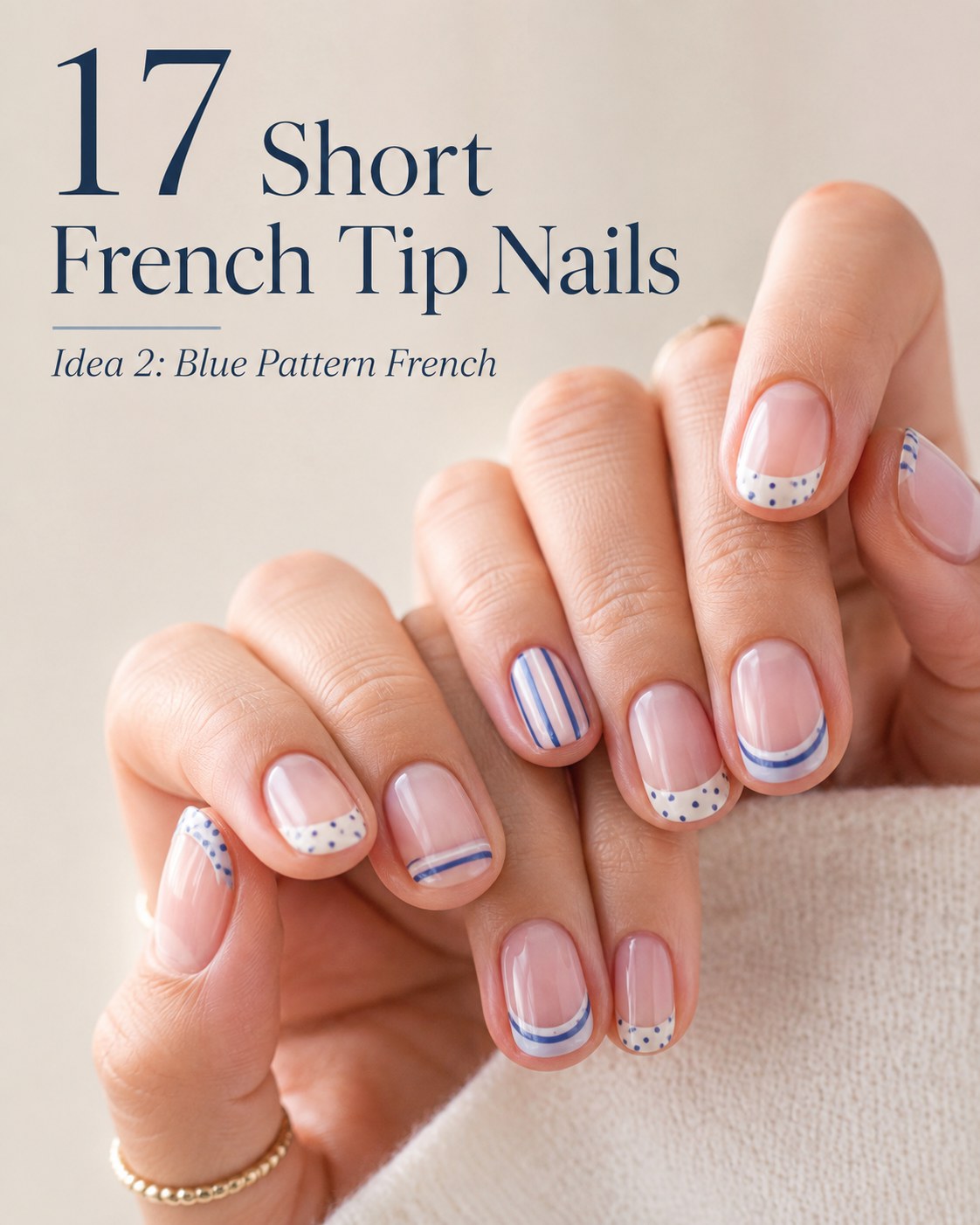 Short french tip nails featuring mismatched blue stripes and dotted accent patterns